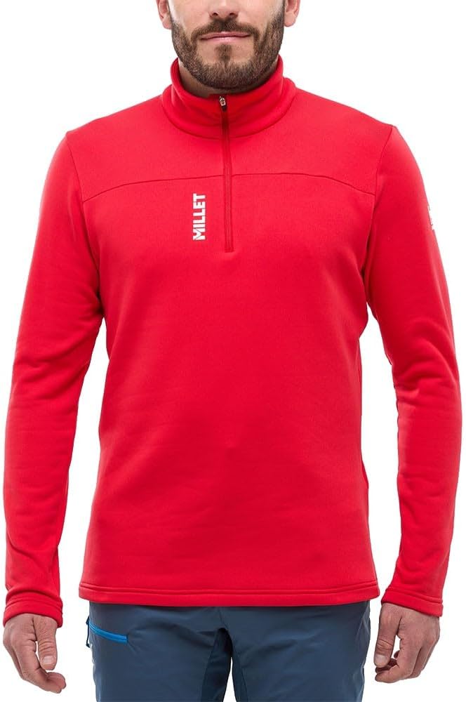 Veste Millet Homme Rouge pliée dans un sac à dos de randonnée